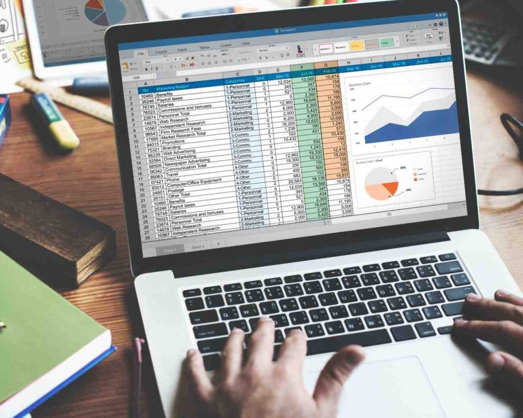 student working on the excel sheet in a corporate office